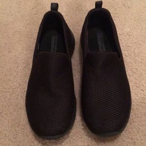 Black sketchers slip on